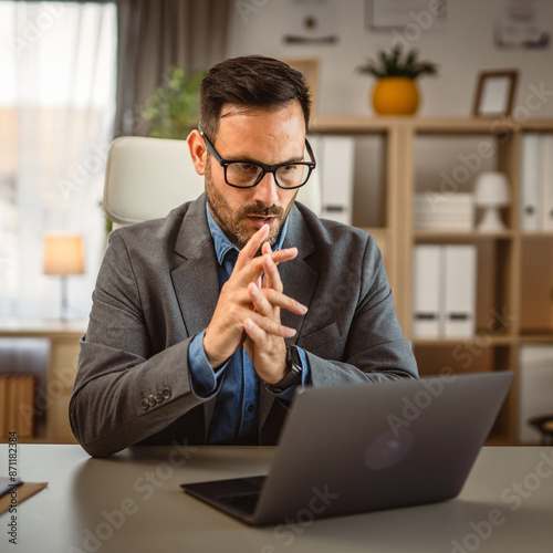 Adult young caucasian businessman work from office photo