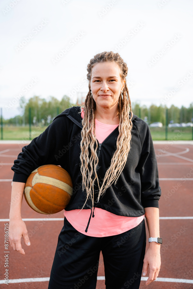 Portrait of a woman on a basketball field Portrait of a woman on a basketball field