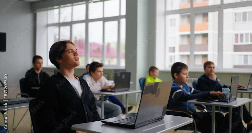 Teenage Student Programmer Asking Teacher In Computer Classroom, Portrait Of High School Boy Teenage Student Programmer Asking Teacher In Computer Classroom, Portrait Of High School Boy