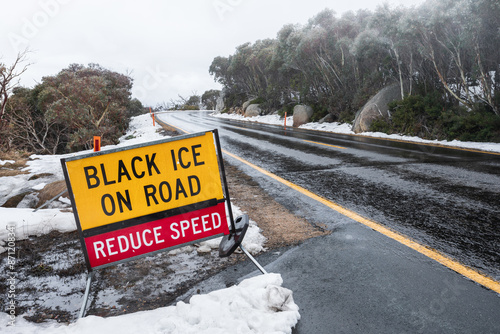 Mount Buffalo National Park. Road with black ice warning sign. photo