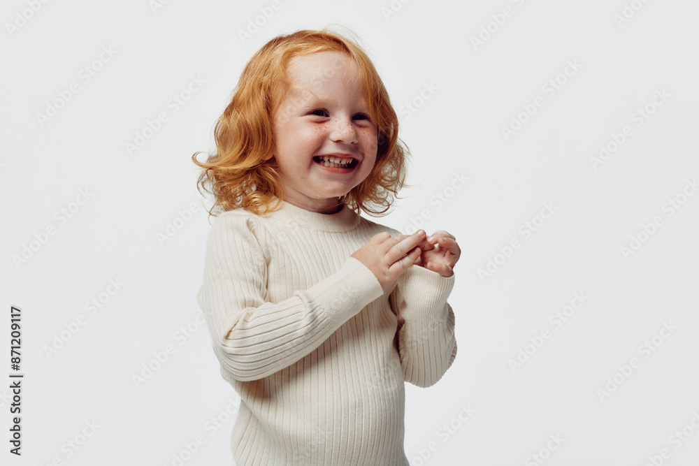 Happy redhaired girl in white turtleneck sweater smiling beauty portrait with joyful expression Happy redhaired girl in white turtleneck sweater smiling beauty portrait with joyful expression