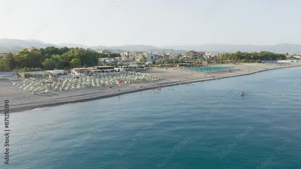 The Relax Of Mediterranean Ocean In Summer Season With People Relaxing The Relax Of Mediterranean Ocean In Summer Season With People Relaxing