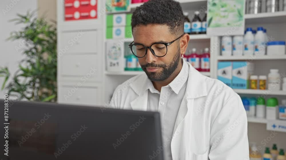 Stressed young african american pharmacist surprised and angry, frustrated with computer work at the pharmacy