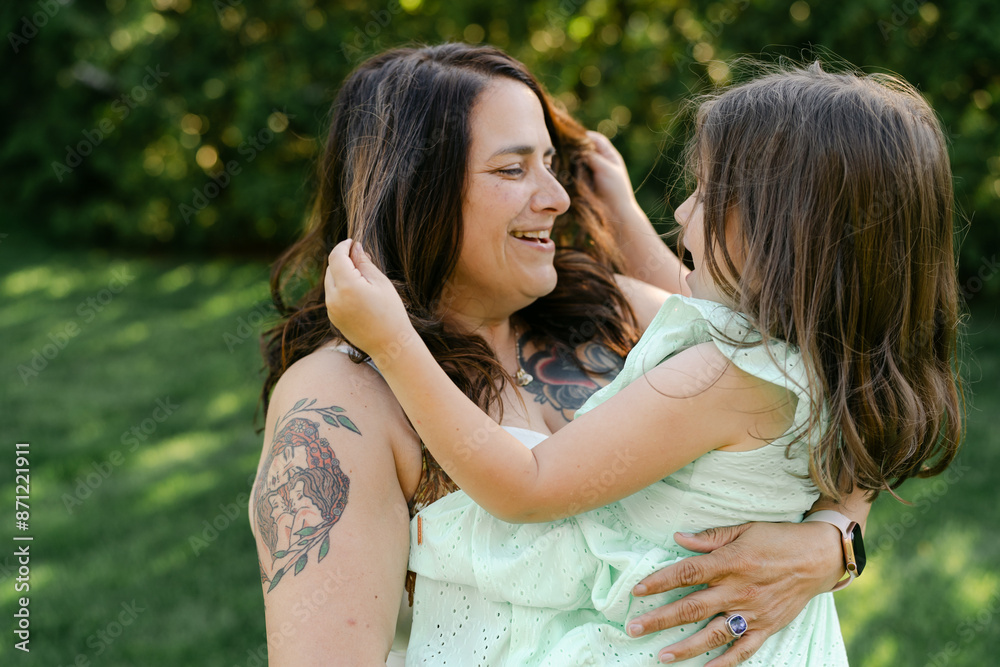 Portrait of mother and daughter outside. Portrait of mother and daughter outside.
