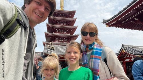 Selfie of a family outdoors with daughters in Tokyo photo
