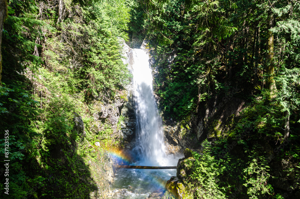 Cascade Falls located Northeast of Mission, BC, Canada. The sunlight falling on the droplets forms a rainbow. Cascade Falls located Northeast of Mission, BC, Canada. The sunlight falling on the droplets forms a rainbow.