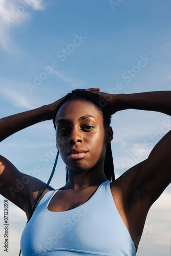 Portrait captures the confident demeanor of an athletic woman photo