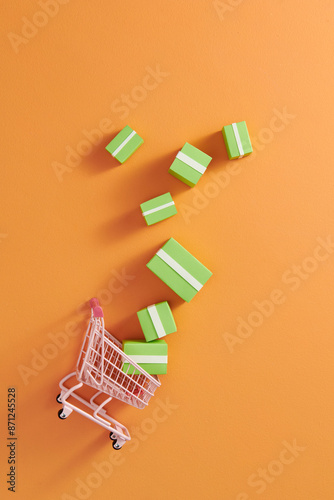 Toy shopping cart with boxes shopping and delivery concept.