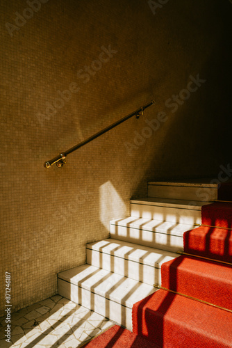 Sunlit Red Carpeted Staircase