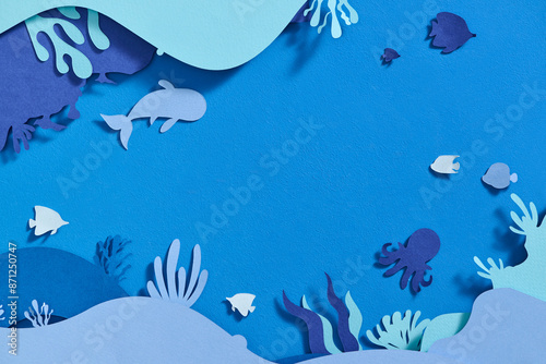 Paper underwater sea cave with fishes, coral reef in the seabed photo