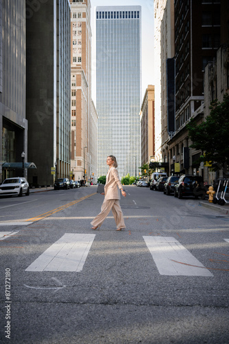 Wallpaper Mural A woman walks down a city street Torontodigital.ca