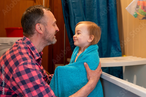 dad and child at bathroom  photo