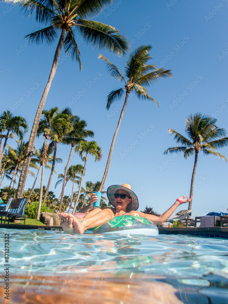 A tourist floats in a pool 