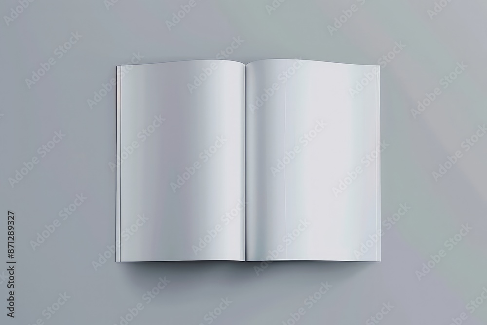 Blank white open magazine on the grey background Blank white open magazine on the grey background