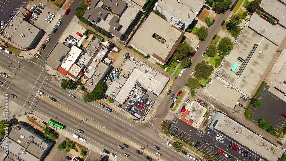 Aerial Top Forward Cars Moving On Roads Amidst Buildings Over City Landscape - Los Angeles, California Aerial Top Forward Cars Moving On Roads Amidst Buildings Over City Landscape - Los Angeles, California