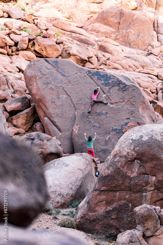 Climber climbing a boulder, weekend activity photo