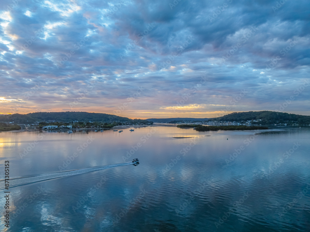 Sunrise over the bay water with clouds and reflections Sunrise over the bay water with clouds and reflections