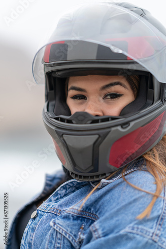 Portrait of beauty motorbike driver with helmet outdoors