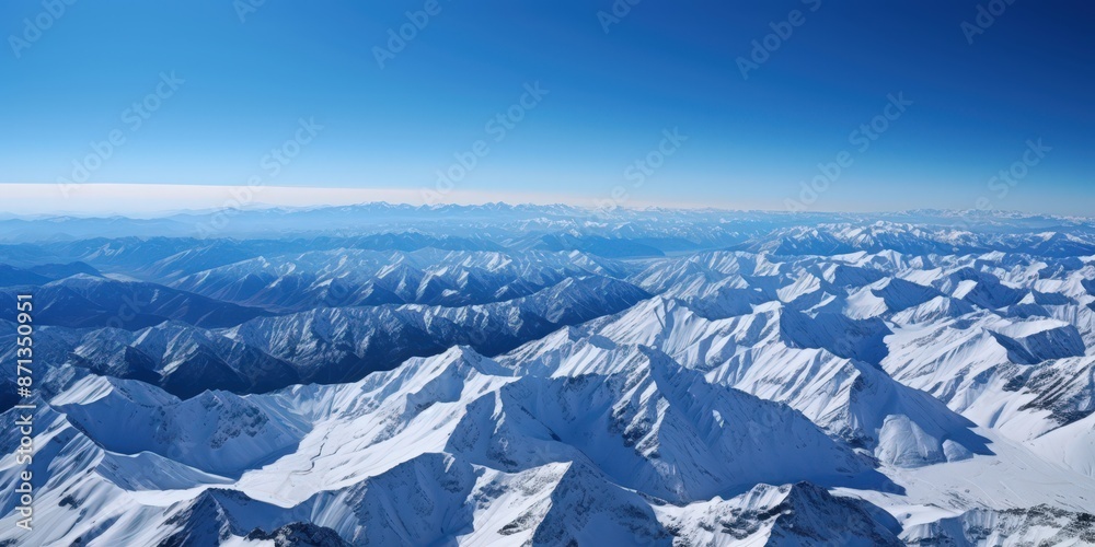 Fototapeta premium Aerial View of Majestic Snow-Capped Mountains