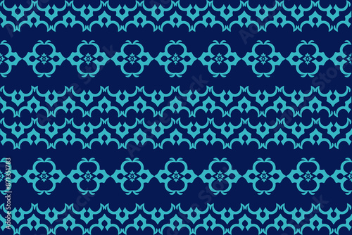 Striking geometric seamless pattern in turquoise on navy. Inspired by Native American  Aztec designs, this boho-chic pattern is perfect for textiles  fashion accessories like bandanas  sarongs.