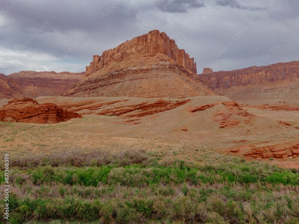 Canyon, green trees and buttes in Moab, Utah, United States of America. Canyon, green trees and buttes in Moab, Utah, United States of America.