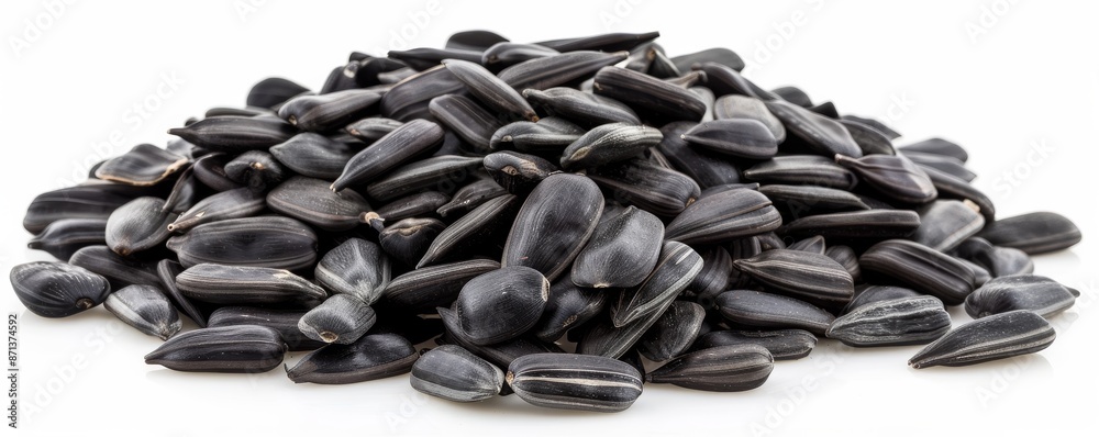 Pile of black sunflower seeds on a white background