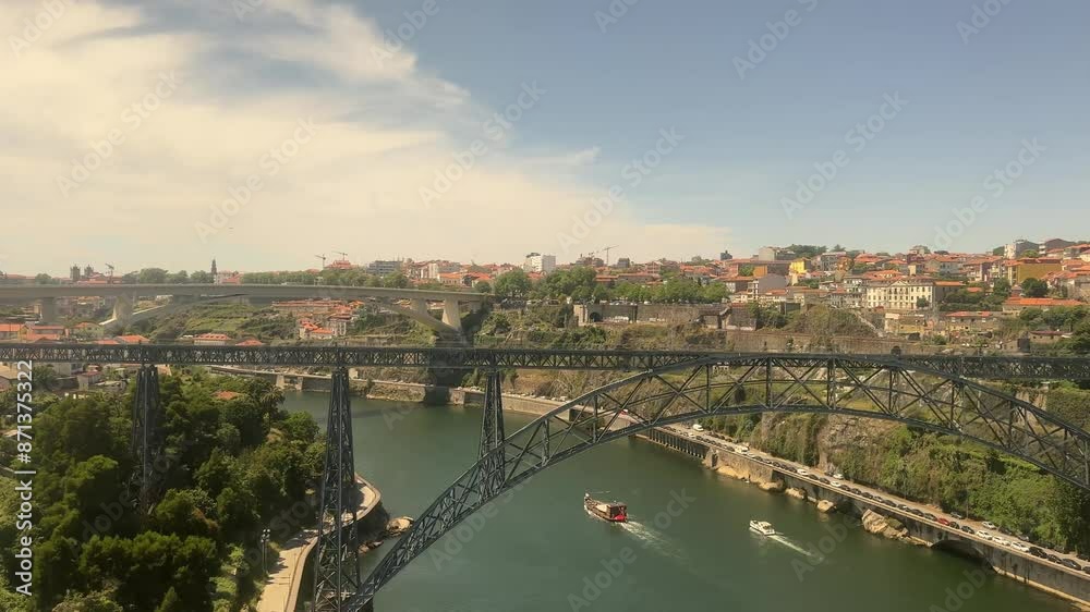 Point of view shot from the train of the double-deck metal arch Dom Luís I Bridge and scenic Douro River approaching Porto, Portugal. Point of view shot from the train of the double-deck metal arch Dom Luís I Bridge and scenic Douro River approaching Porto, Portugal.