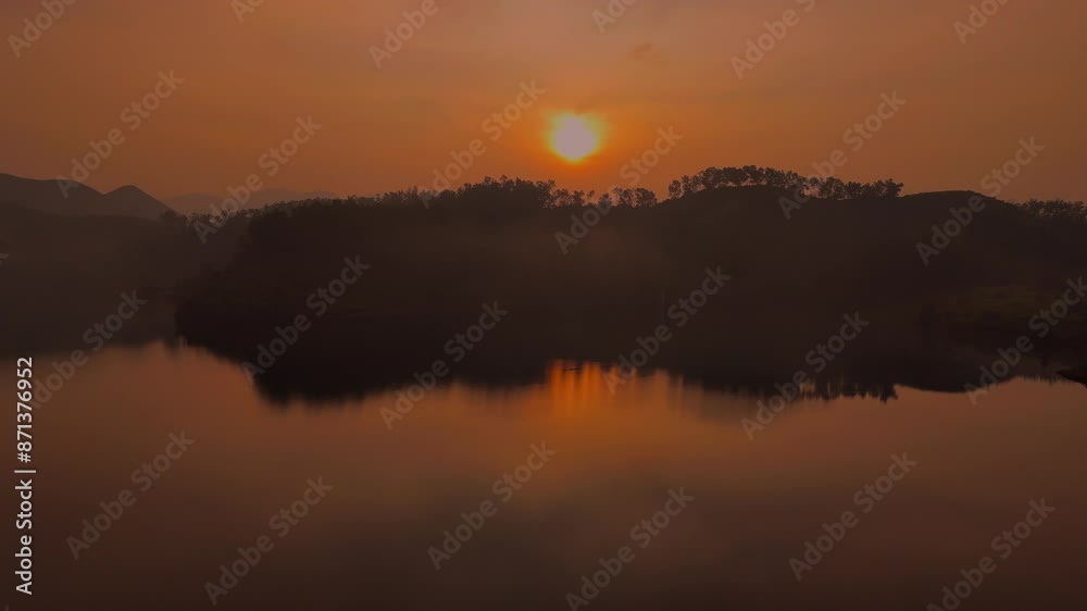 Beautiful landscape with high rocks with illuminated peaks, stones in mountain lake, reflection, blue sky and yellow sunlight in sunrise in kerala, india Beautiful landscape with high rocks with illuminated peaks, stones in mountain lake, reflection, blue sky and yellow sunlight in sunrise in kerala, india
