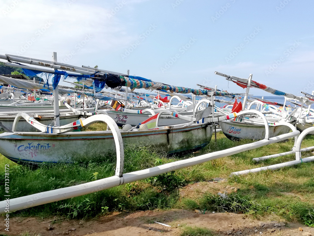Traditional colorful fisherman boats, parked on the beach side Traditional colorful fisherman boats, parked on the beach side