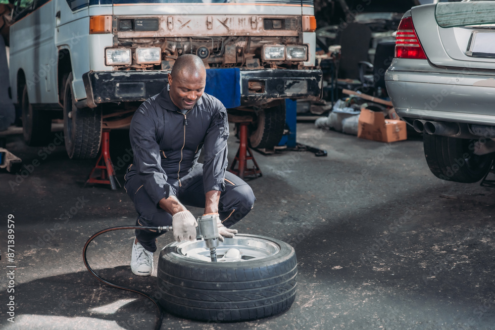 Mechanic Fixing Car Tire.. Mechanic Fixing Car Tire..