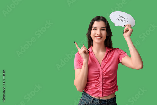 Pretty young woman holding ...