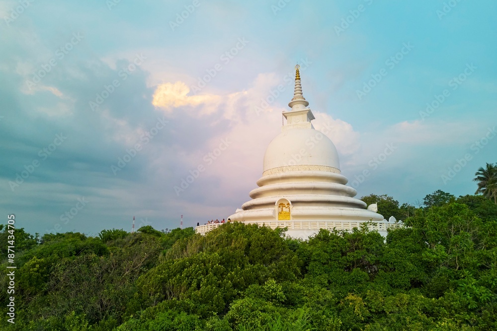 A white buddhist stupa temple in the jungle. Japanese Peace Pagoda in Sri Lanka A white buddhist stupa temple in the jungle. Japanese Peace Pagoda in Sri Lanka