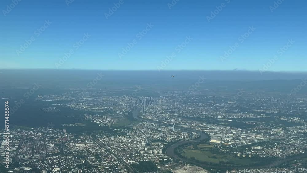 POV Frankfurt aerial view of the city covered with smoke and pollution. Sot from an airplane cockpit arriving to the airport. Another jet on the right side. 4K 60FPS POV Frankfurt aerial view of the city covered with smoke and pollution. Sot from an airplane cockpit arriving to the airport. Another jet on the right side. 4K 60FPS