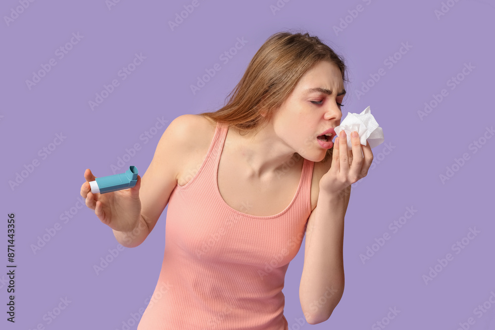 Woman with inhaler and napkin having asthma attack on purple background Woman with inhaler and napkin having asthma attack on purple background