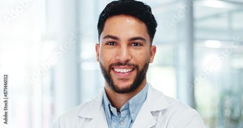 Healthcare, man and face of doctor in portrait with confidence, pride or medical expertise in hospital. Male surgeon, medicare or smile in lobby for achievement, help or happiness for career success © peopleimages.com