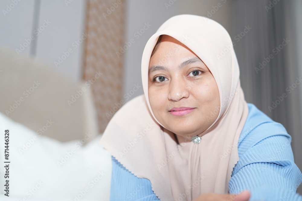 Muslim woman is relaxing and relaxing in bed