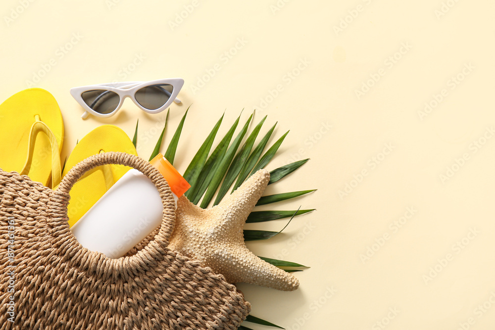 Fototapeta premium Beautiful composition with beach accessories on beige background