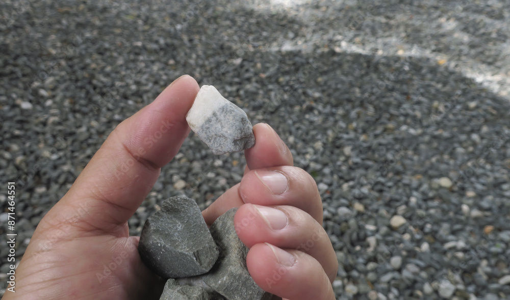 Lime stone mix in haft with calcite in the hand Lime stone mix in haft with calcite in the hand