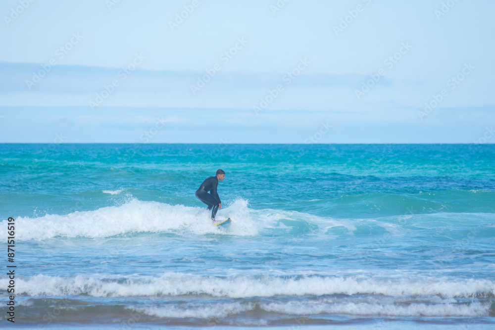 professional surfer riding waves, men catching waves in ocean, isolated. Surfing action water board sport. people water sport lessons and beach swimming activity on summer vacation professional surfer riding waves, men catching waves in ocean, isolated. Surfing action water board sport. people water sport lessons and beach swimming activity on summer vacation