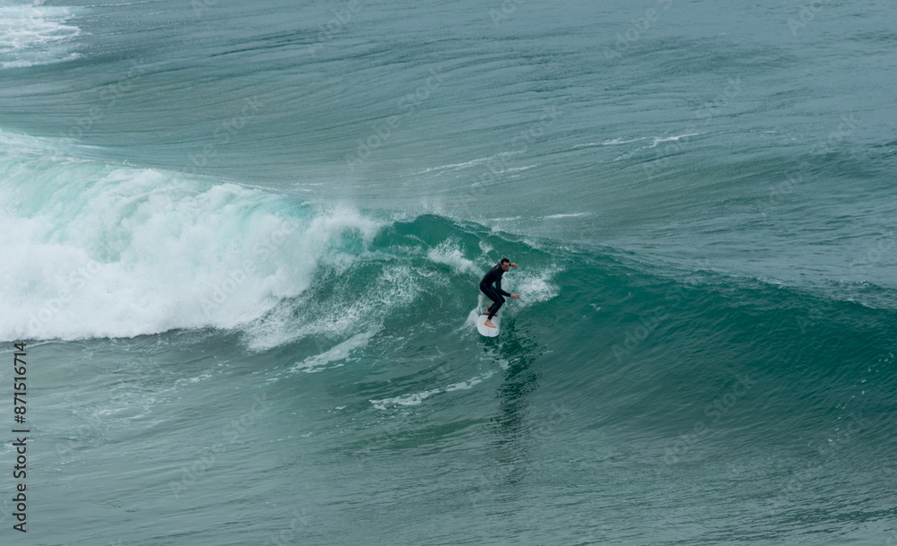 professional surfer riding waves, men catching waves in ocean, isolated. Surfing action water board sport. people water sport lessons and beach swimming activity on summer vacation professional surfer riding waves, men catching waves in ocean, isolated. Surfing action water board sport. people water sport lessons and beach swimming activity on summer vacation