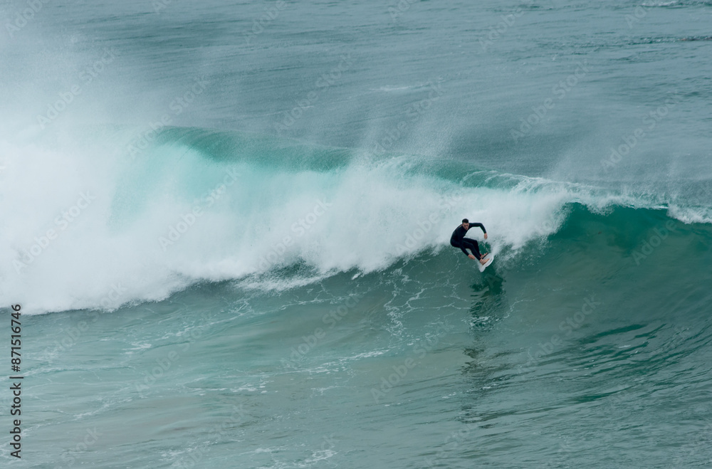 professional surfer riding waves, men catching waves in ocean, isolated. Surfing action water board sport. people water sport lessons and beach swimming activity on summer vacation professional surfer riding waves, men catching waves in ocean, isolated. Surfing action water board sport. people water sport lessons and beach swimming activity on summer vacation