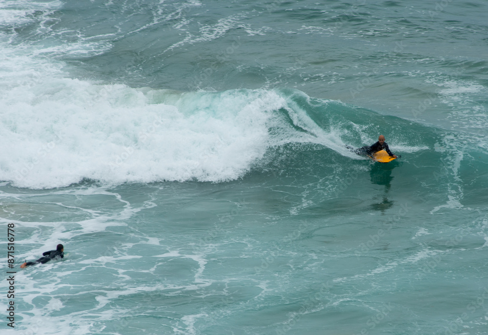 professional surfer riding waves, men catching waves in ocean, isolated. Surfing action water board sport. people water sport lessons and beach swimming activity on summer vacation professional surfer riding waves, men catching waves in ocean, isolated. Surfing action water board sport. people water sport lessons and beach swimming activity on summer vacation