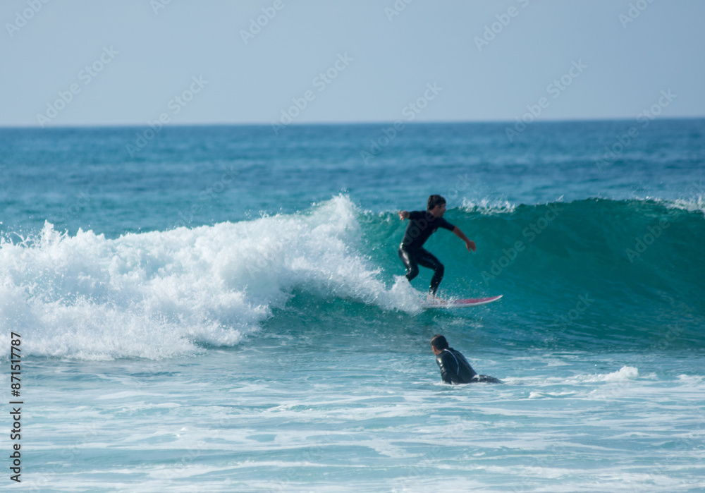 professional surfer riding waves, men catching waves in ocean, isolated. Surfing action water board sport. people water sport lessons and beach swimming activity on summer vacation professional surfer riding waves, men catching waves in ocean, isolated. Surfing action water board sport. people water sport lessons and beach swimming activity on summer vacation