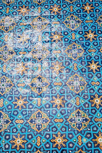 retro ceramic tile with traditional Uzbek ornament Arabic Islamic pattern on wall of the old ancient Muslim mosque Hazrati Imam in Uzbekistan