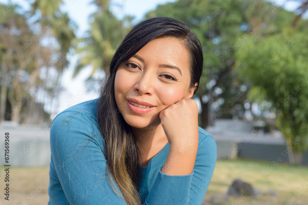 Woman in a public park with positive attitude, smiling. Woman in a public park with positive attitude, smiling.