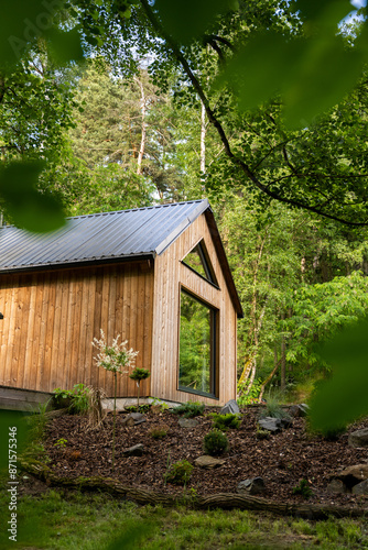 Modern wooden cottage in the forest