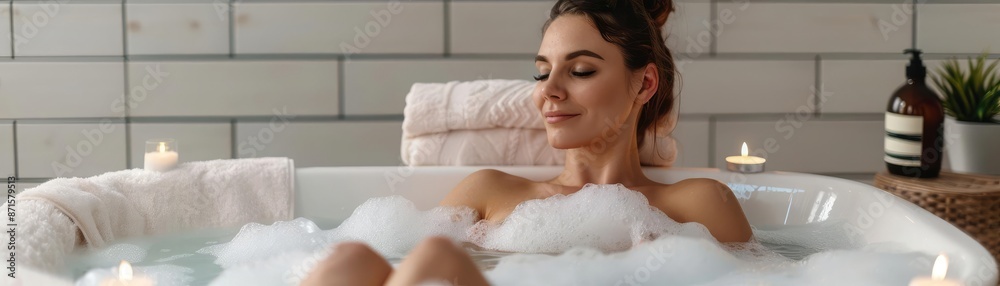 Woman in a bubble bath with candles and music, relaxation, soothing techniques and complete balance Woman in a bubble bath with candles and music, relaxation, soothing techniques and complete balance
