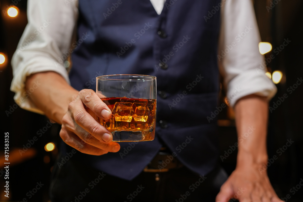 Bartender pouring Whiskey, on bar Bartender pouring Whiskey, on bar