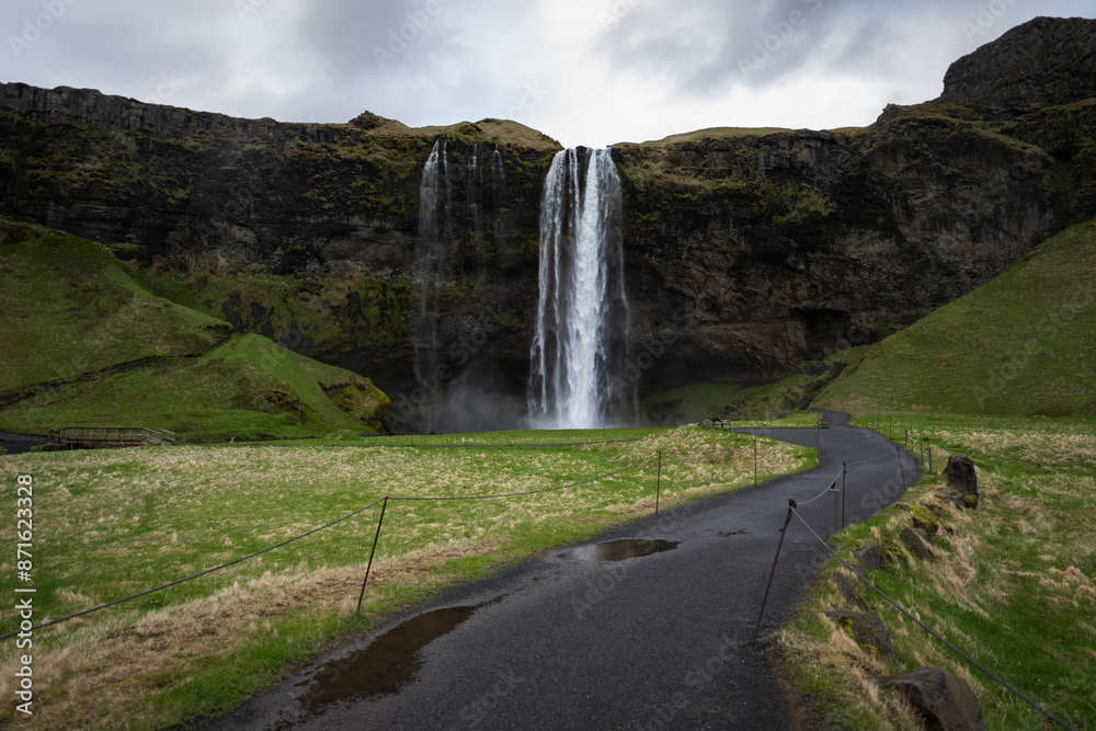 Seljalandsfoss waterfall on south iceland in moody weather in summer Seljalandsfoss waterfall on south iceland in moody weather in summer
