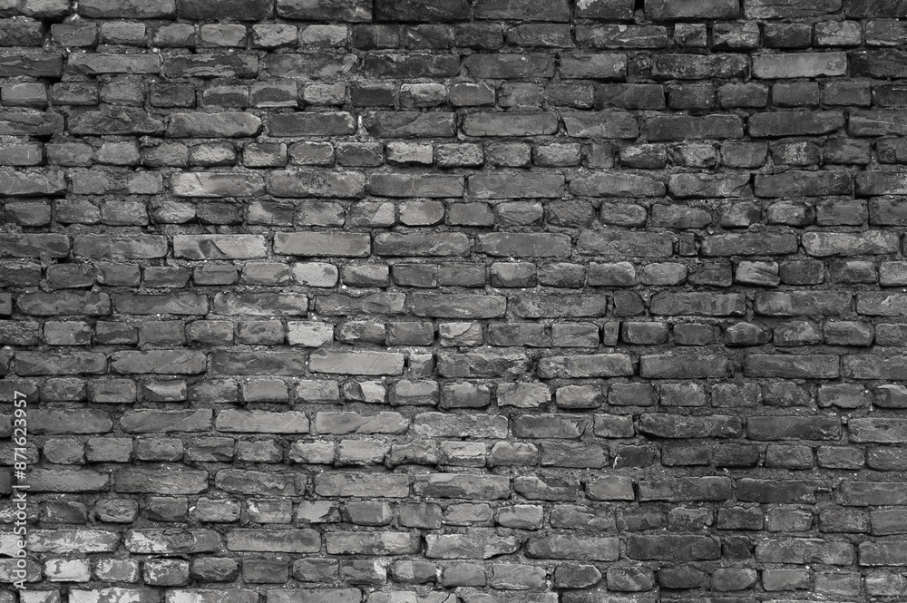 Fototapeta premium gray wall made of old brick close-up